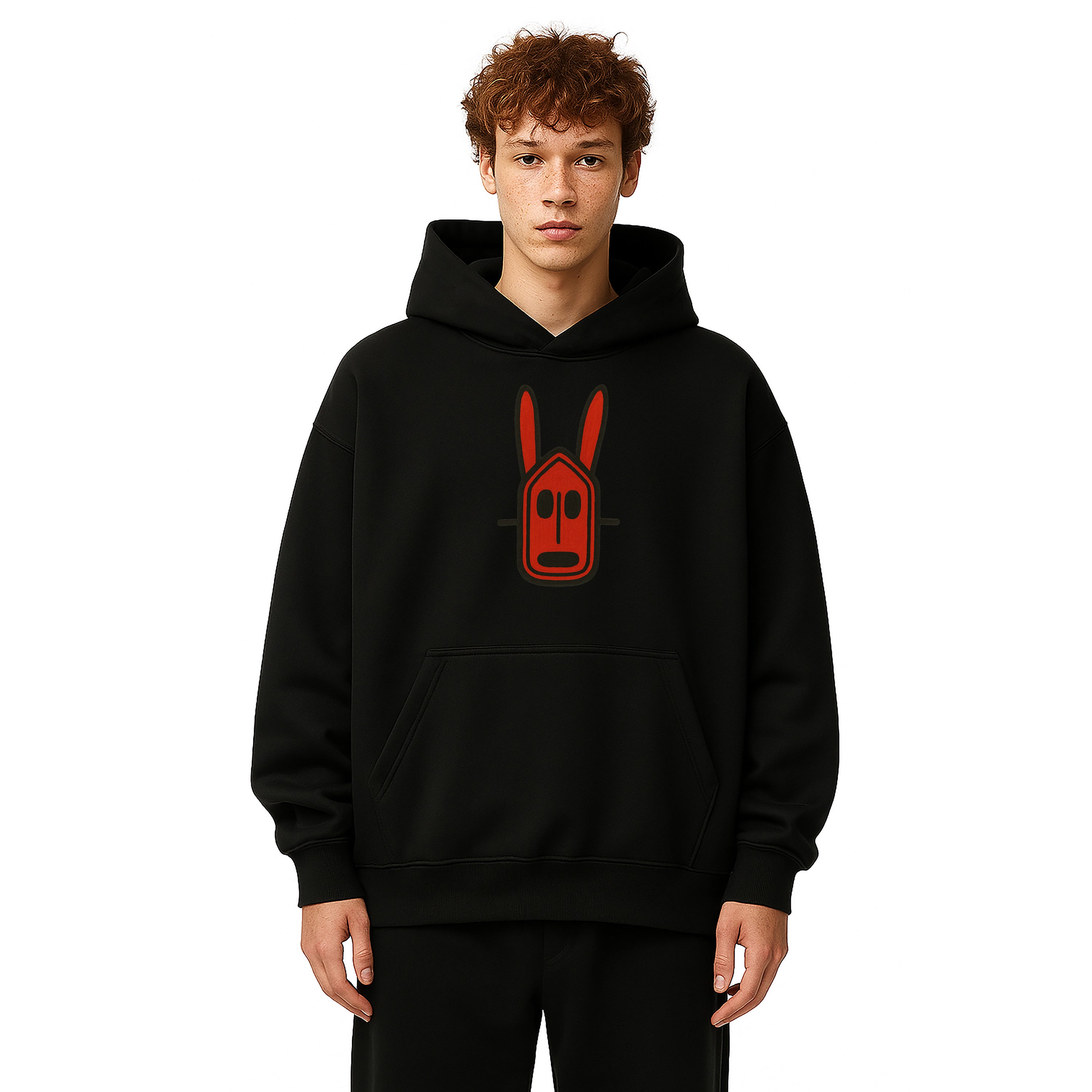 Model wears black hoodie with red crimson Mali Dogon African Mask at the center chest on a solid white background