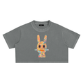Ink Drip Solar Patina Crop Top with abstract watercolor Dogon mask graphic on washed grey fabric.
