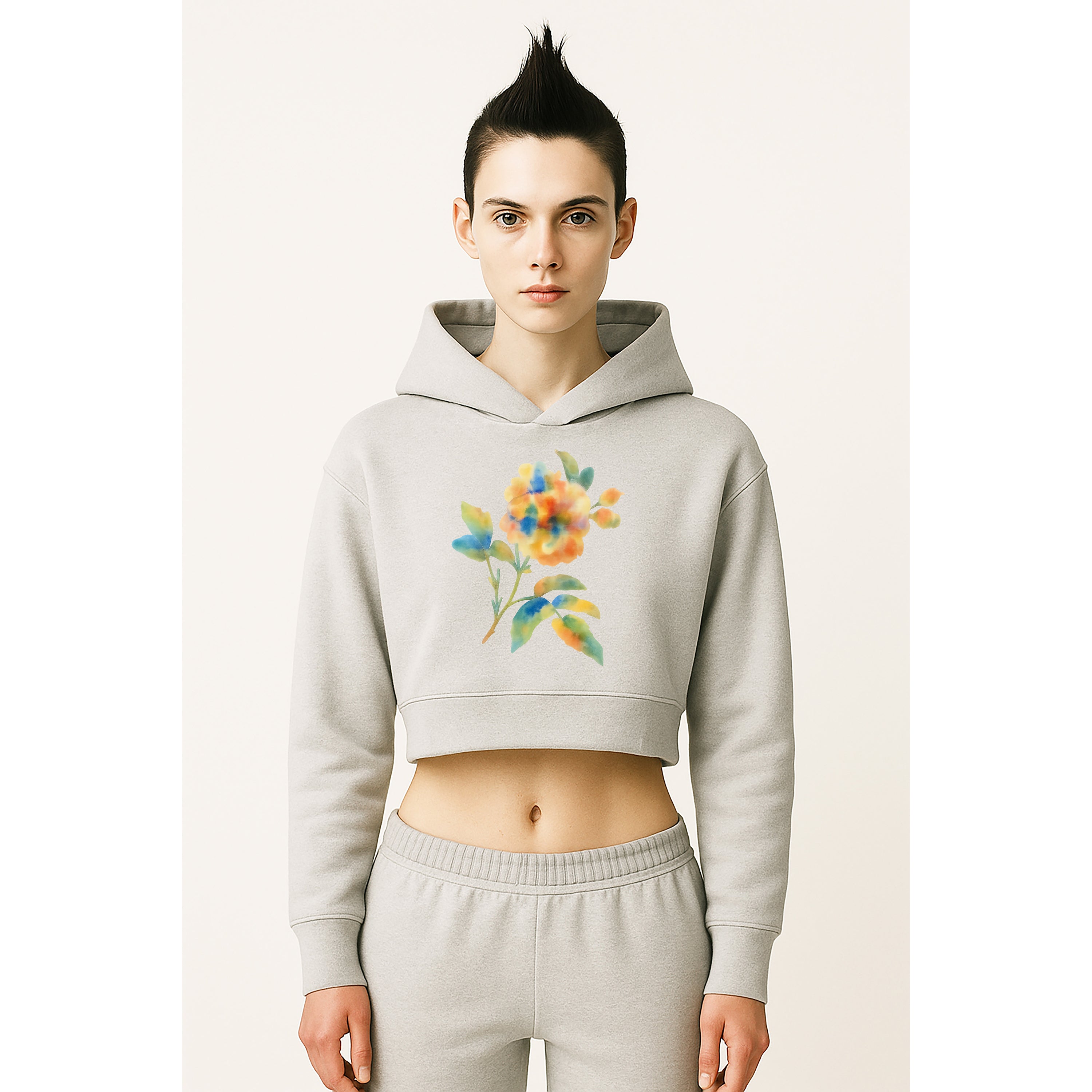 Model wears cropped heather grey hoodie with watercolor multicolor floral flower print