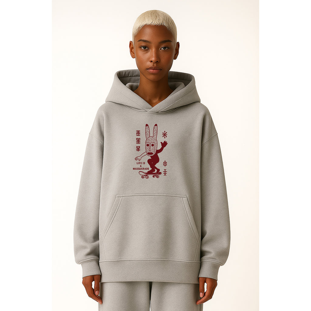 Model wears nomad_07 Dogon Drift heavyweight hoodie in Ash Grey with Dogon-inspired graphic