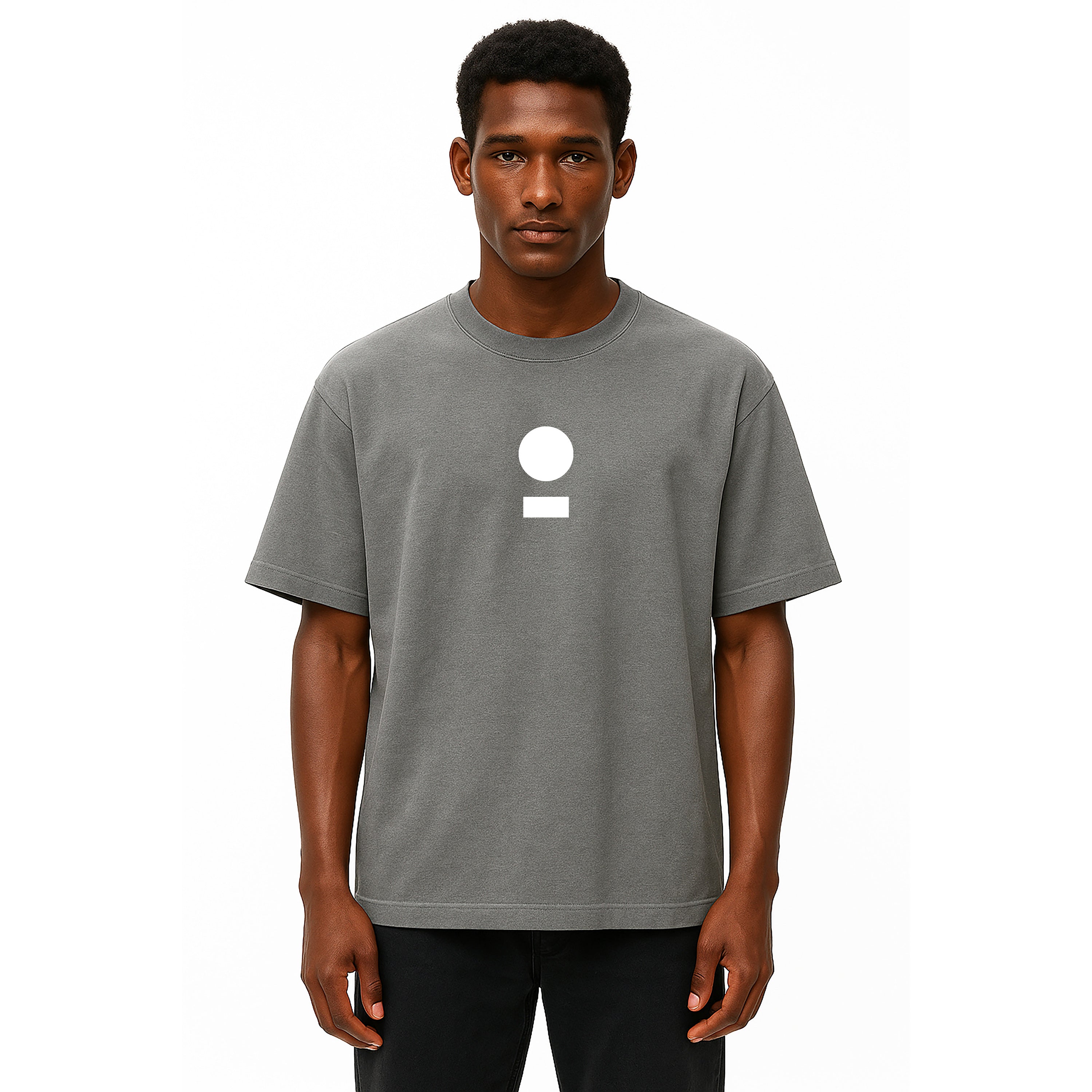 model wears nomad_07 Logo Heavyweight Tee in Smoke Clay with centered core logo, oversized unisex silhouette.