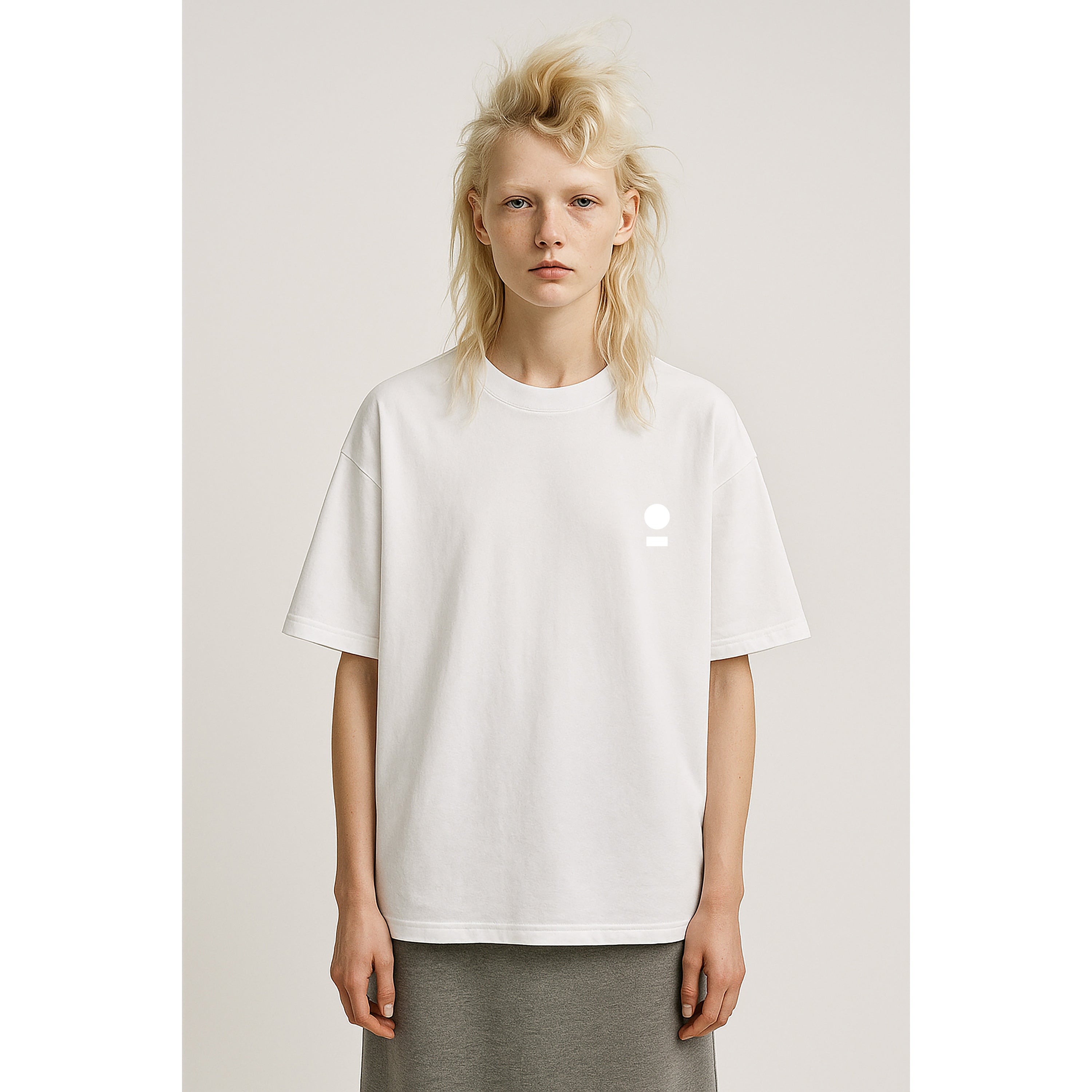 Model wears nomad_07 heavyweight chalk white t-shirt with minimalist world and path chest logo