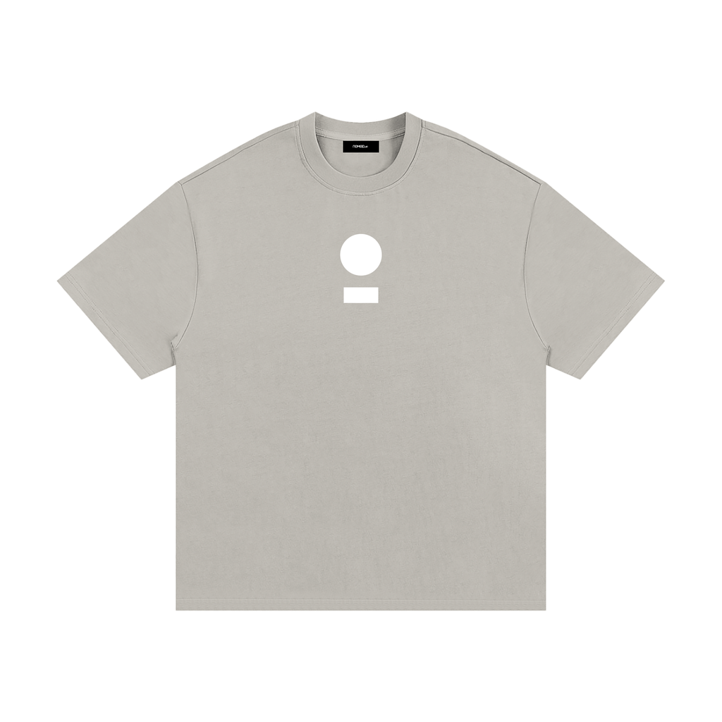 nomad_07 Logo Heavyweight Tee in Smoke Clay with centered core logo, oversized unisex silhouette.