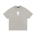 nomad_07 Logo Heavyweight Tee in Smoke Clay with centered core logo, oversized unisex silhouette.