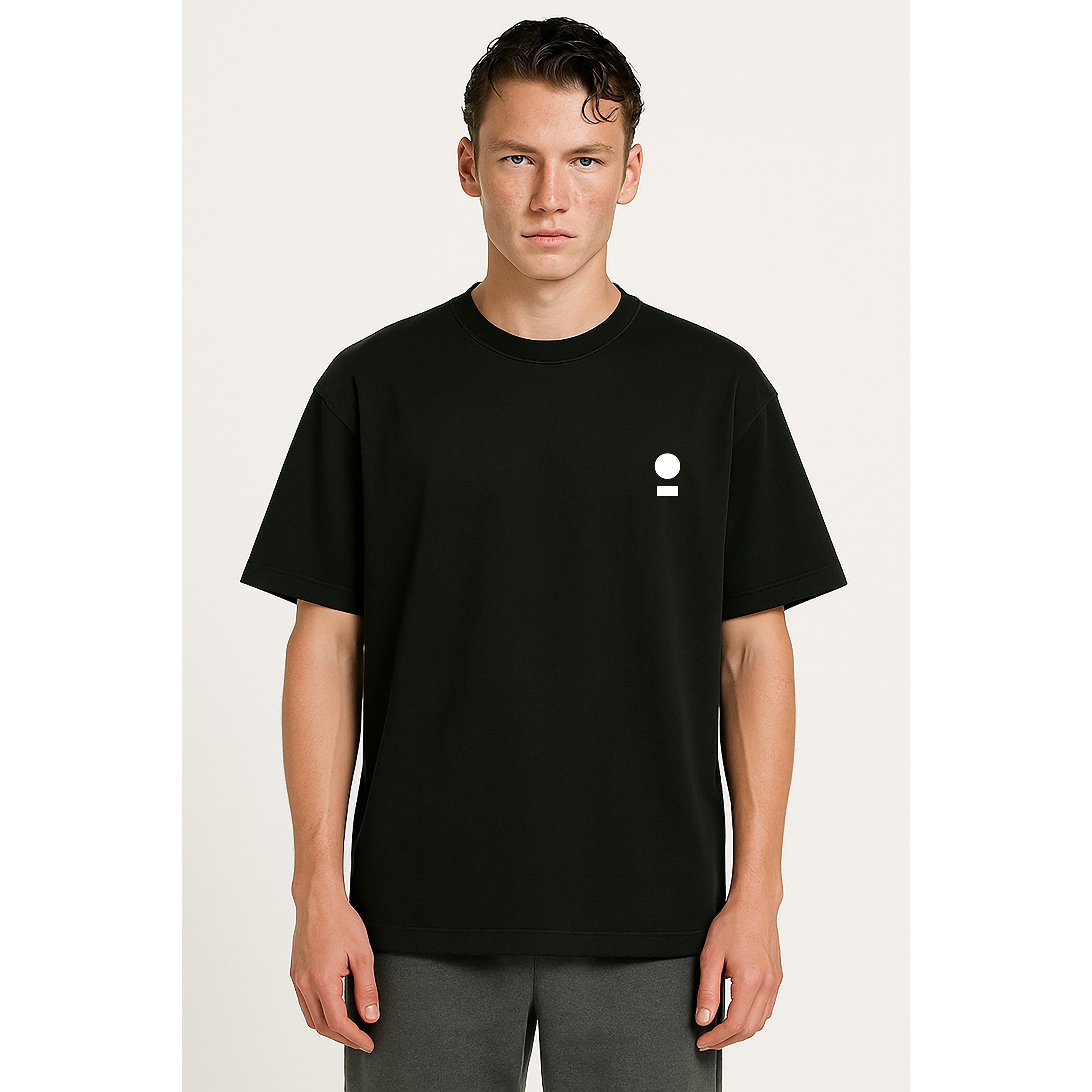 Model wear nomad_07 heavyweight black onyx t-shirt with white world and path chest logo